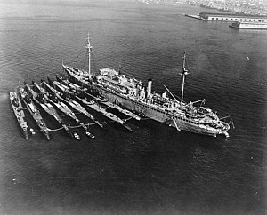 AS 3 USS Holland with seven submarines alongside at San Diego, California on 24 December 1934