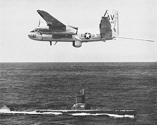 SS 485 Grumman S2F-3 Tracker of VS-36 in flight over USS Sirago (SS-485), in 1962